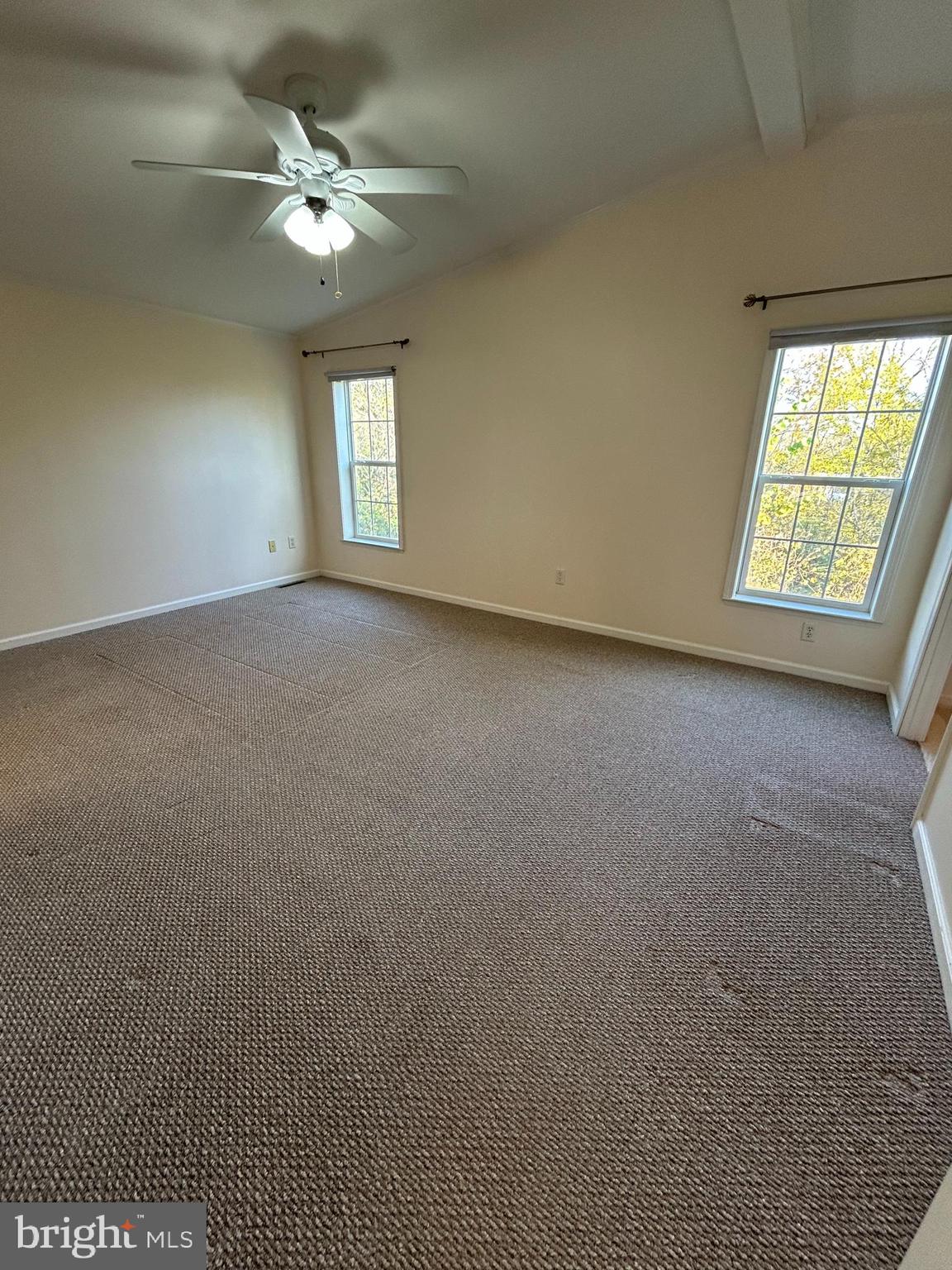 94 Random Road Douglassville, PA 19518 - Photo 16 of 27 an empty room with windows and ceiling fan