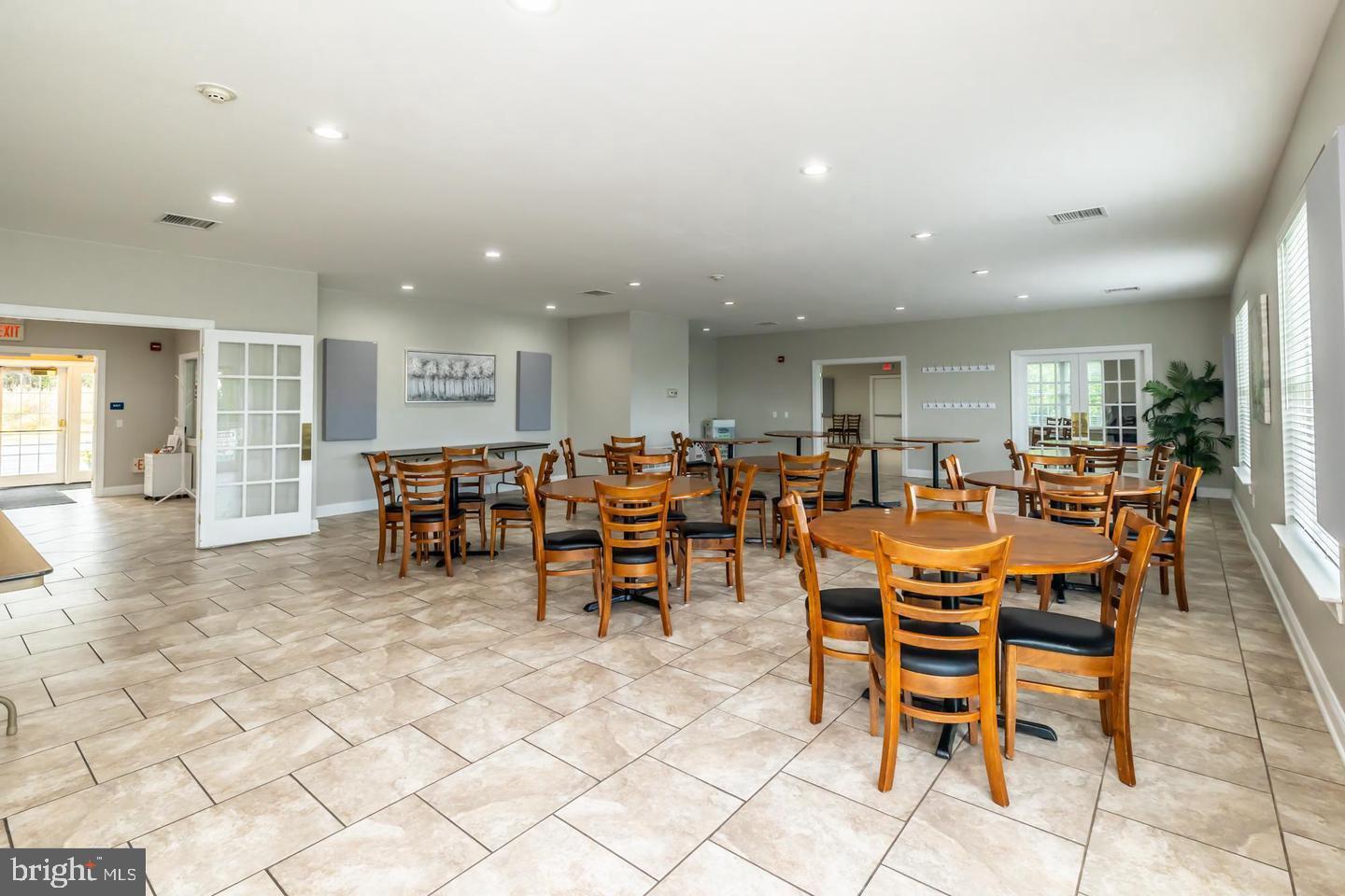 94 Random Road Douglassville, PA 19518 - Photo 26 of 27 a group of chairs sitting in kitchen and dining room
