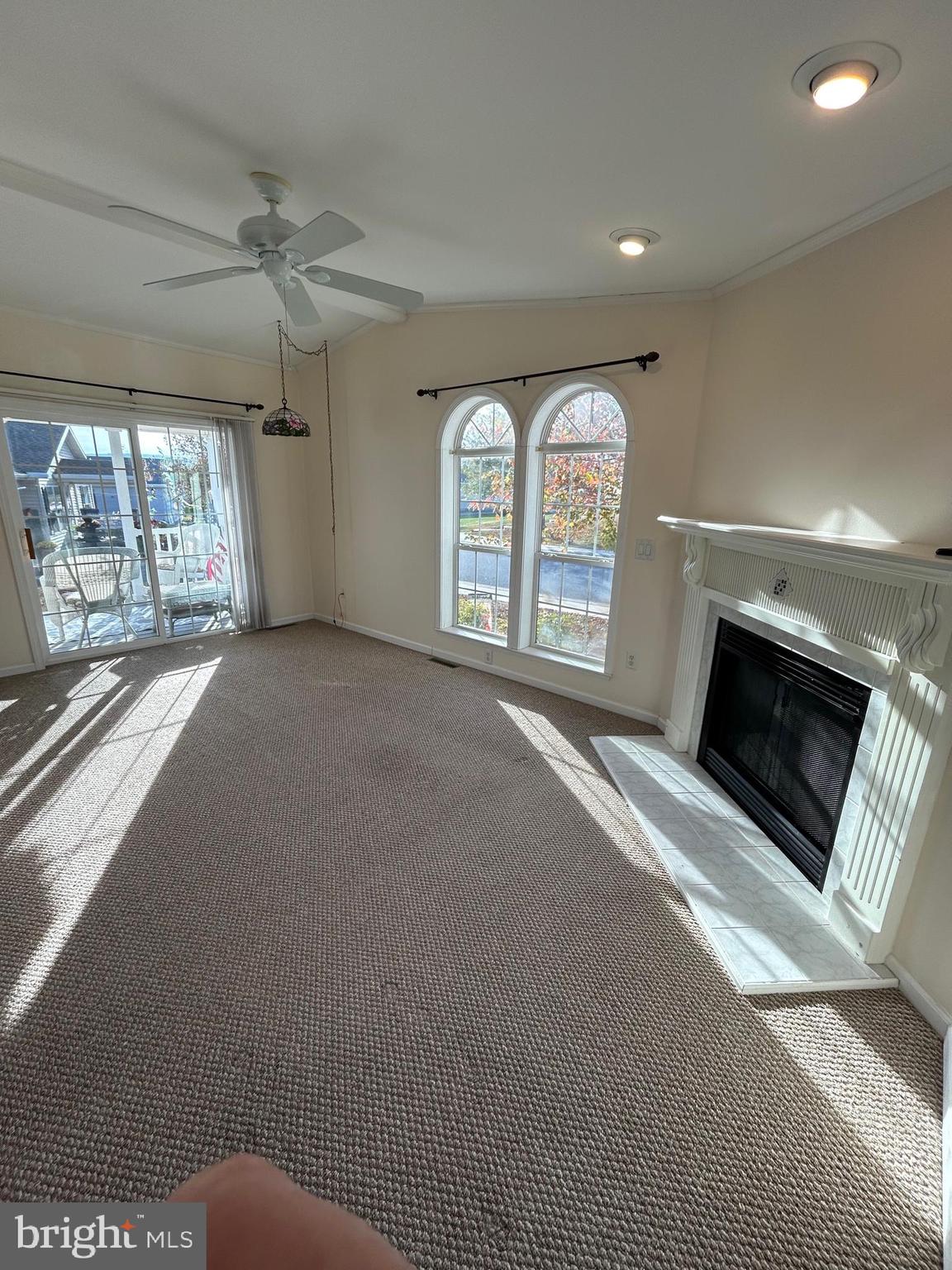 94 Random Road Douglassville, PA 19518 - Photo 5 of 27 a view of an empty room with a fireplace and a window