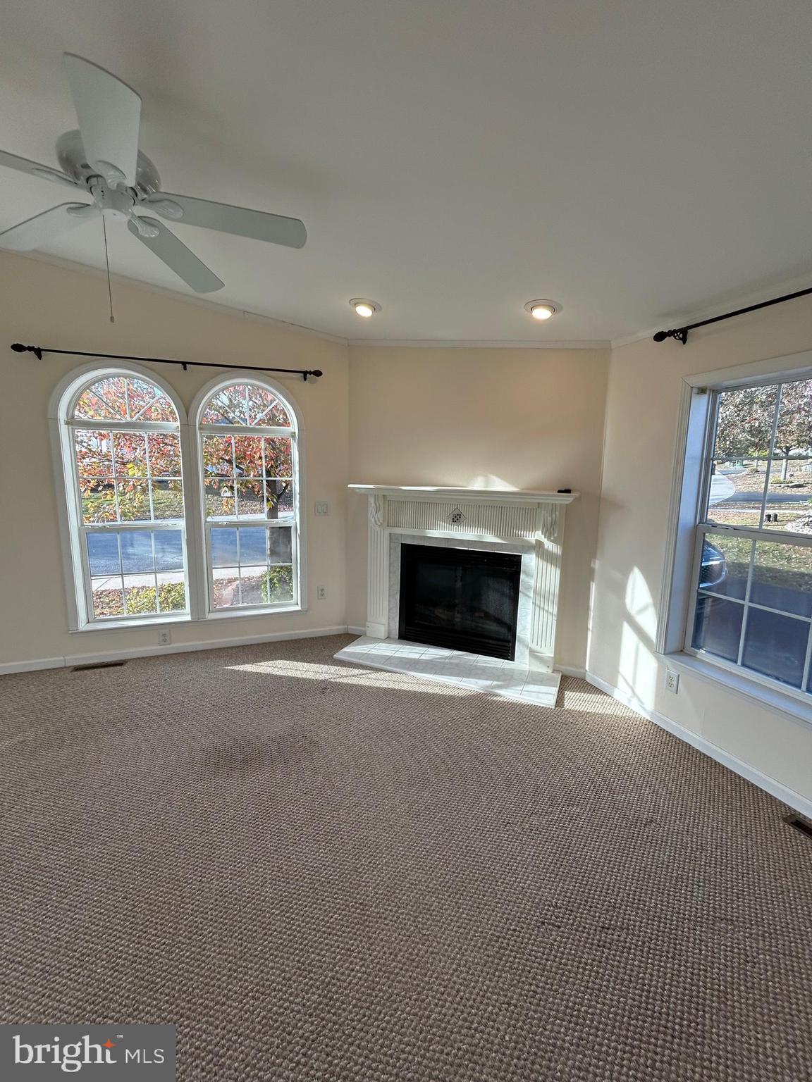 94 Random Road Douglassville, PA 19518 - Photo 6 of 27 a view of an empty room with a fireplace and a window