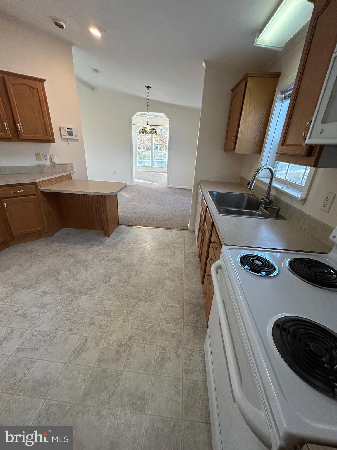94 Random Road Douglassville, PA 19518 - Photo 7 of 27 a kitchen with a stove and a sink