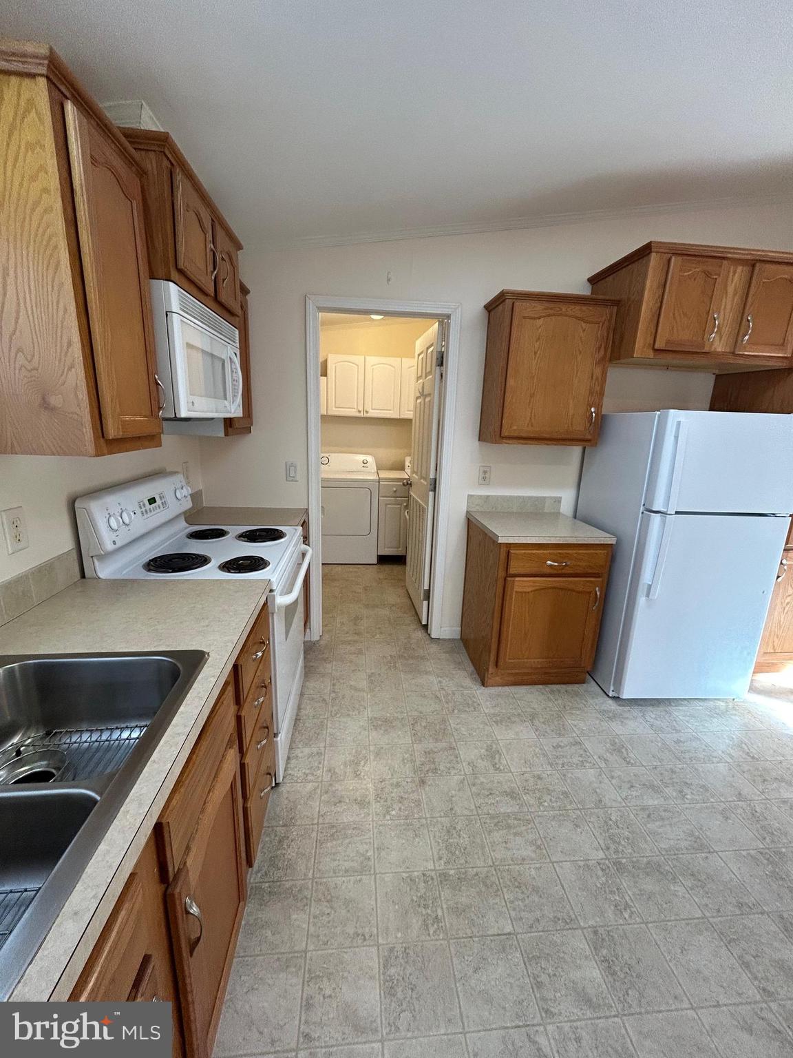 94 Random Road Douglassville, PA 19518 - Photo 8 of 27 a kitchen that has a sink wooden floor and a stove