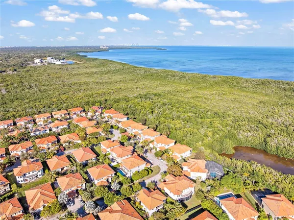 a view of an empty room with floor to ceiling windows