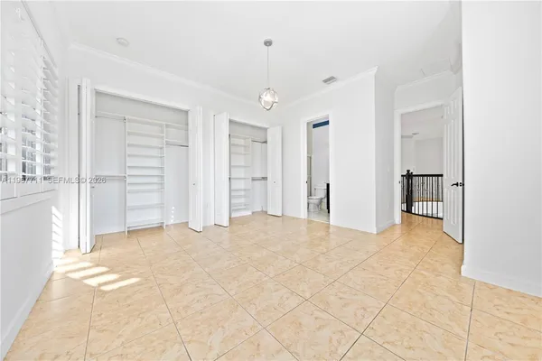 a large kitchen with granite countertop a stove a sink dishwasher and a refrigerator