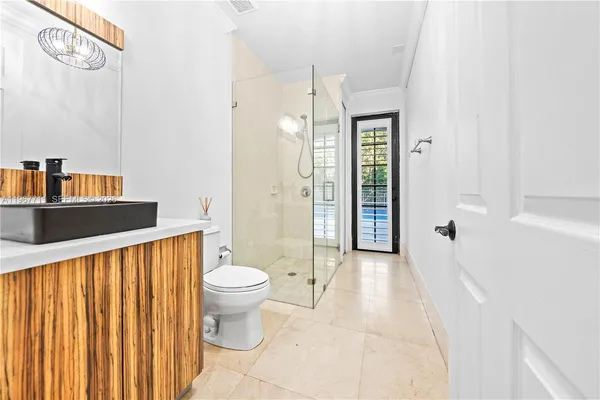 a view of staircase with lots of frames and rug