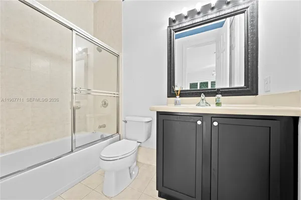 a bathroom with a sink a vanity and a mirror