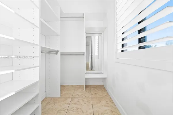 a view of empty room with windows