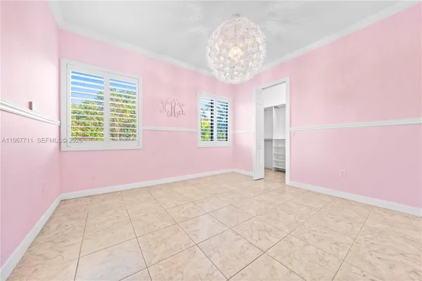 a spacious bathroom with a tub sink and mirror
