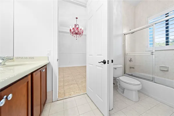 a view of a hallway with windows and entryway