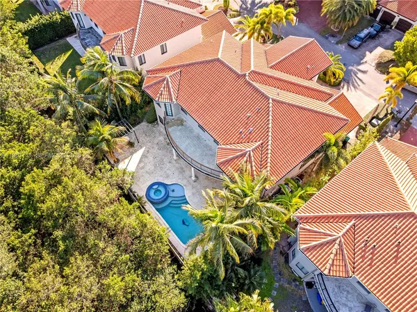 a vase of flowers sitting on a floor
