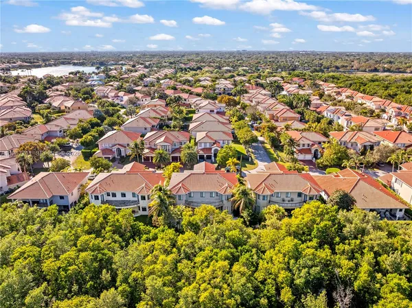 an aerial view of residential houses with outdoor space
