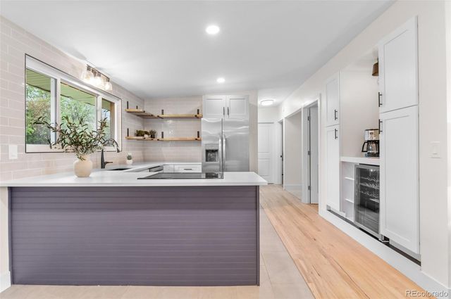 a view of kitchen with wooden floor