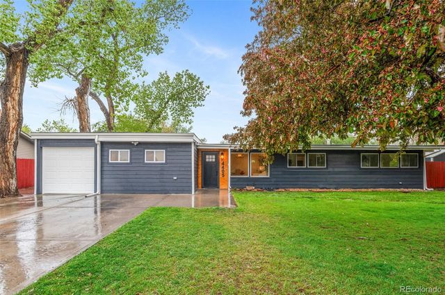 front view of a house with a yard