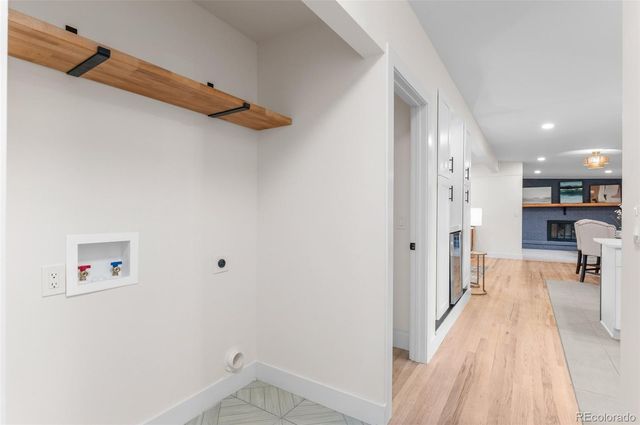 a view of a living room with a wooden floor