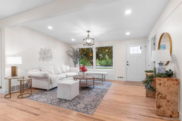 a living room with furniture or window and a table