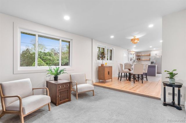 a living room with furniture and a table