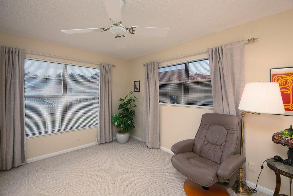 4600 Wildwood Tree Lane, Unit A Boynton Beach, FL 33436 - Photo 12 of 30 a living room with furniture and a window