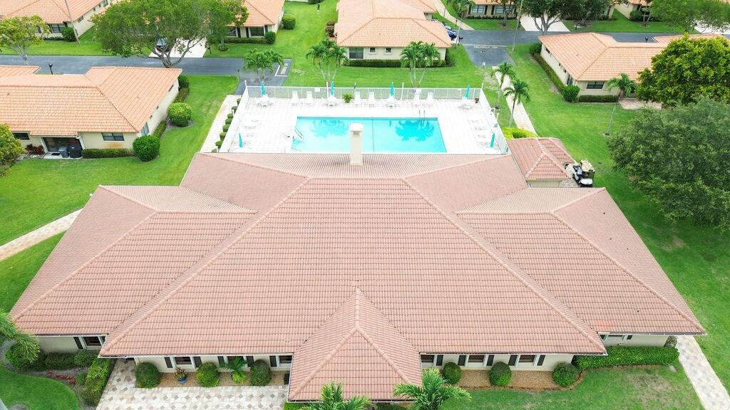 4600 Wildwood Tree Lane, Unit A Boynton Beach, FL 33436 - Photo 28 of 30 a view of a patio with a yard