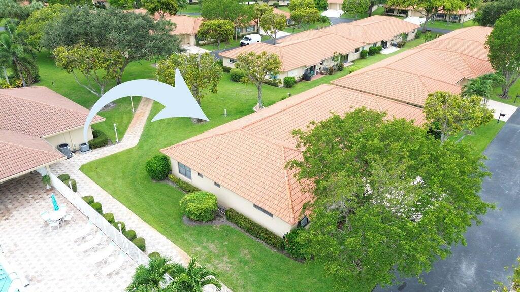 4600 Wildwood Tree Lane, Unit A Boynton Beach, FL 33436 - Photo 30 of 30 an aerial view of a house with swimming pool and large trees