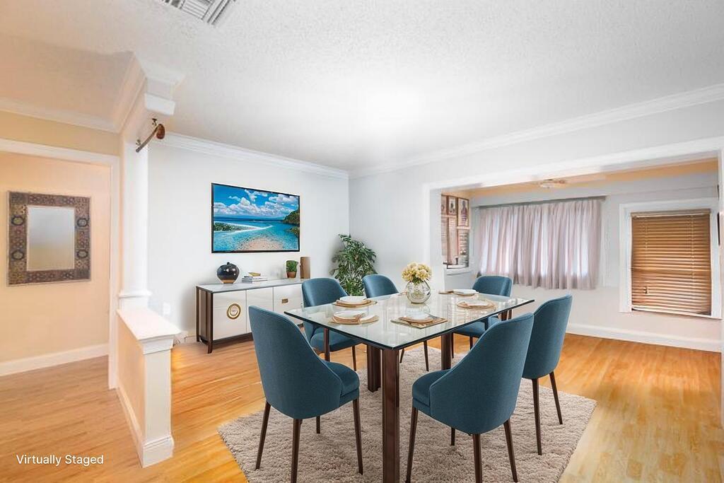 4600 Wildwood Tree Lane, Unit A Boynton Beach, FL 33436 - Photo 4 of 30 a view of a dining room with furniture and wooden floor