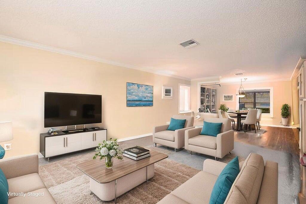 4600 Wildwood Tree Lane, Unit A Boynton Beach, FL 33436 - Photo 6 of 30 a living room with furniture and a flat screen tv