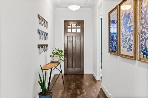 a view of an entryway with wooden floor
