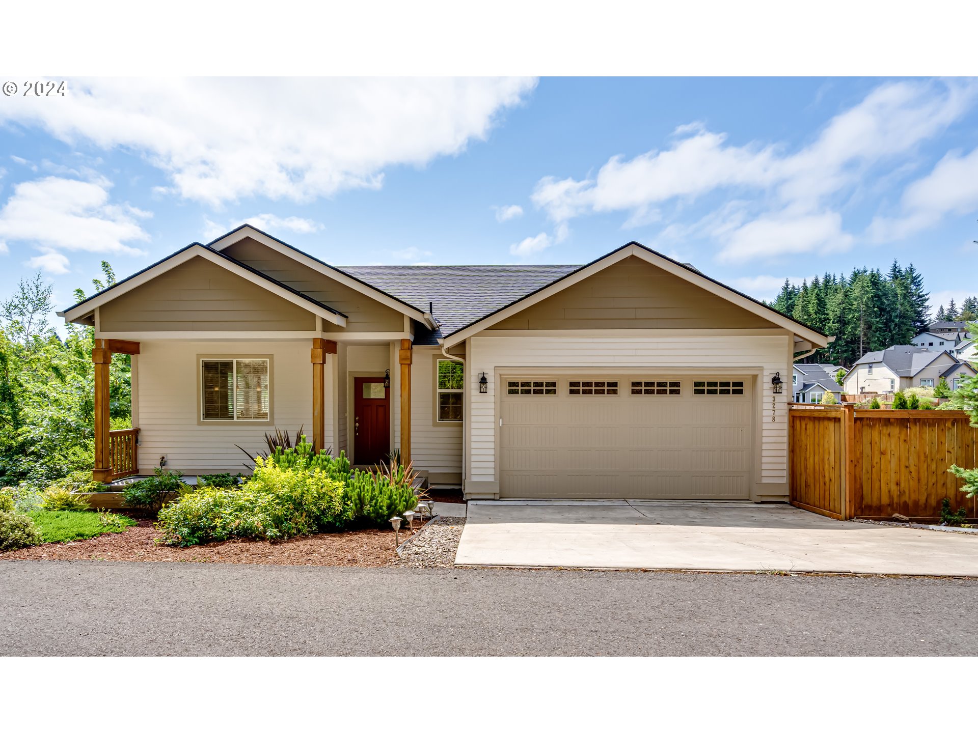 a front view of a house with a garden