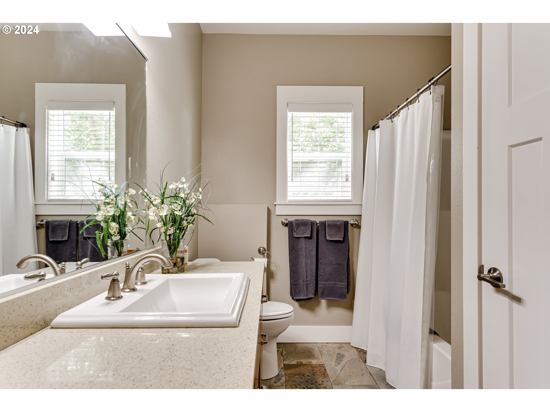 3278 Timberline Drive Eugene, OR 97405 - Photo 24 of 41 a bathroom with a sink a potted plant and a window