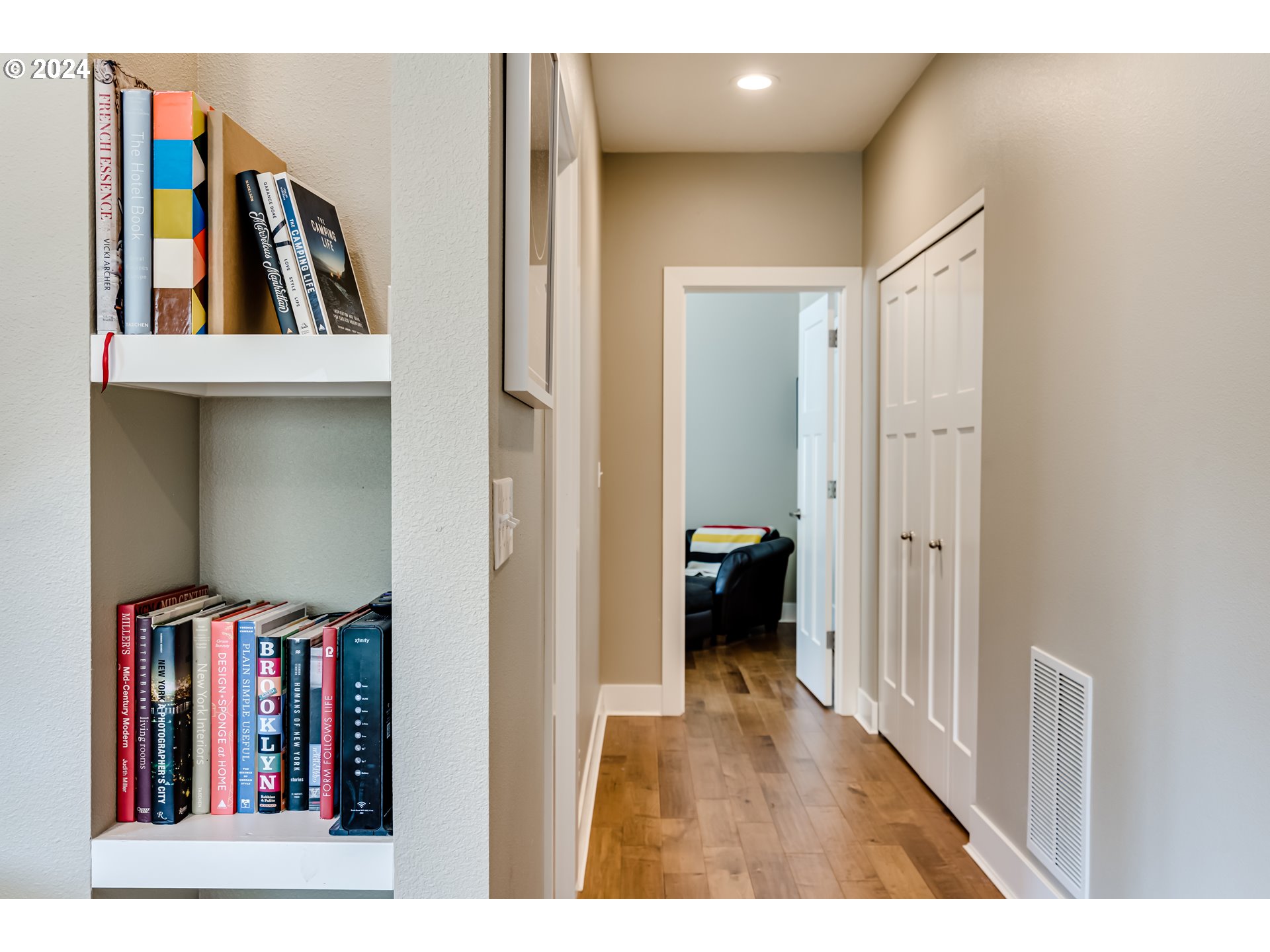 3278 Timberline Drive Eugene, OR 97405 - Photo 27 of 41 a view of a hallway with wooden floor and furniture