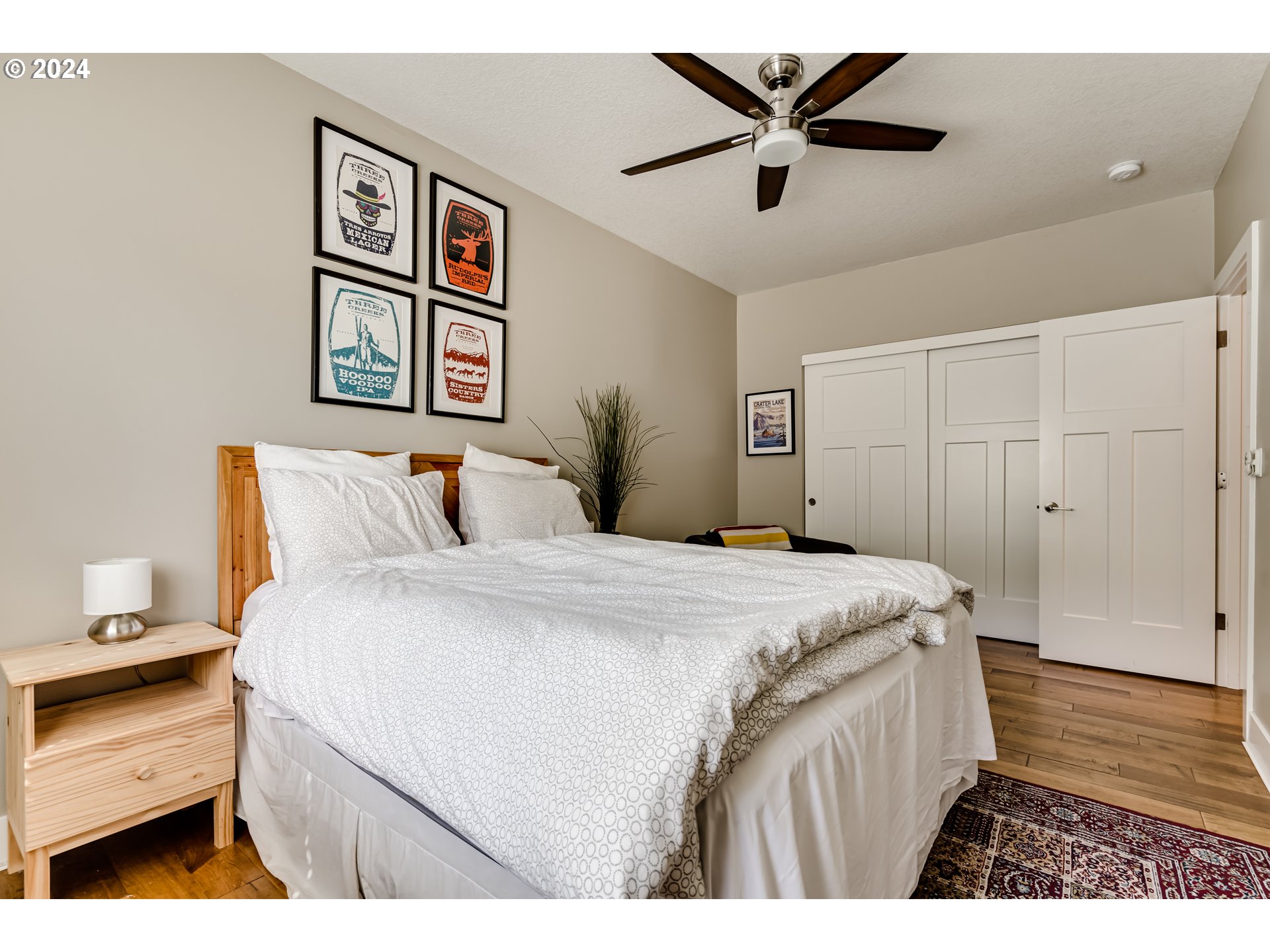 3278 Timberline Drive Eugene, OR 97405 - Photo 30 of 41 a bedroom with a bed and a chandelier
