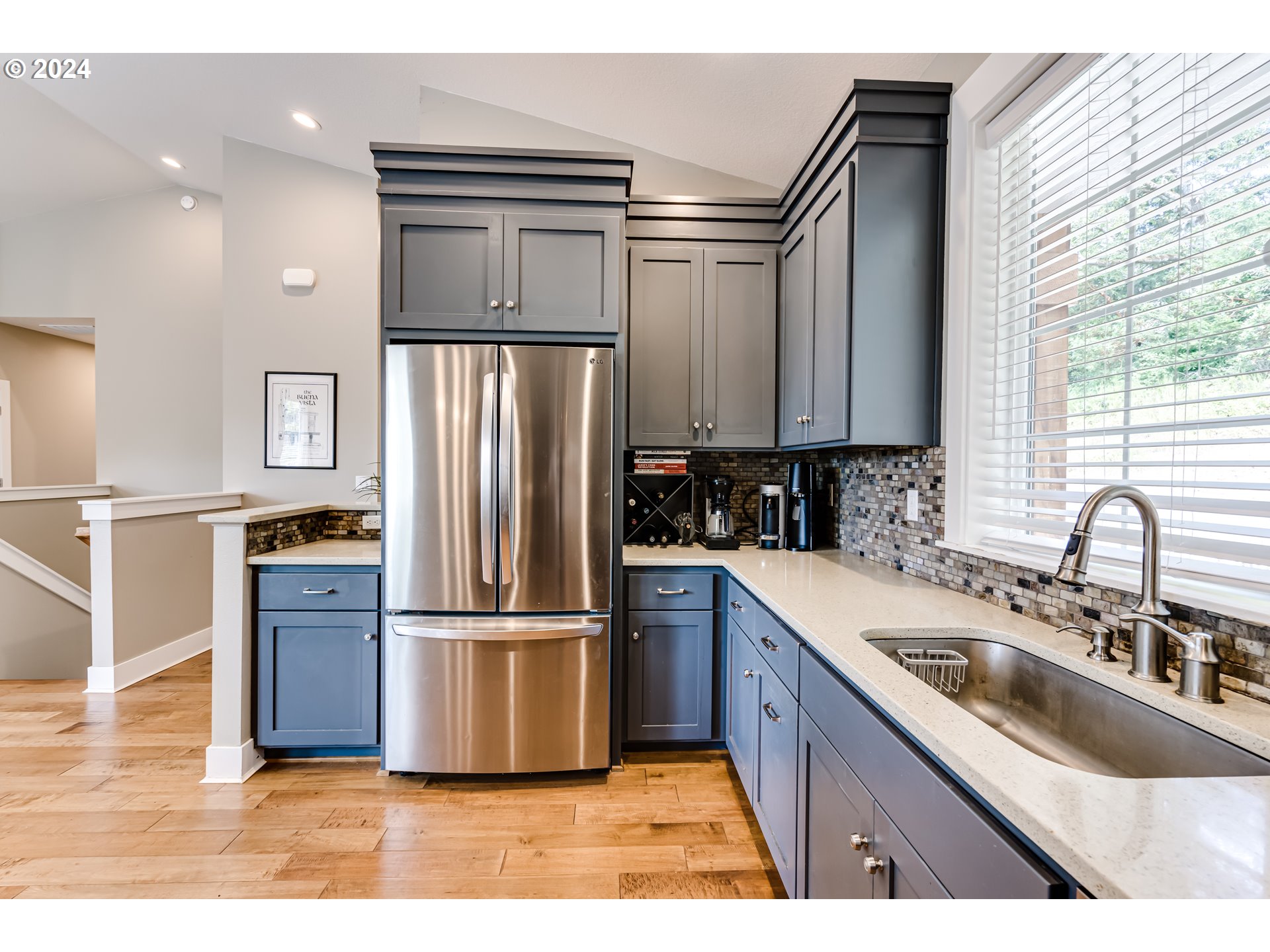 3278 Timberline Drive Eugene, OR 97405 - Photo 4 of 41 a kitchen with granite countertop a refrigerator and a sink