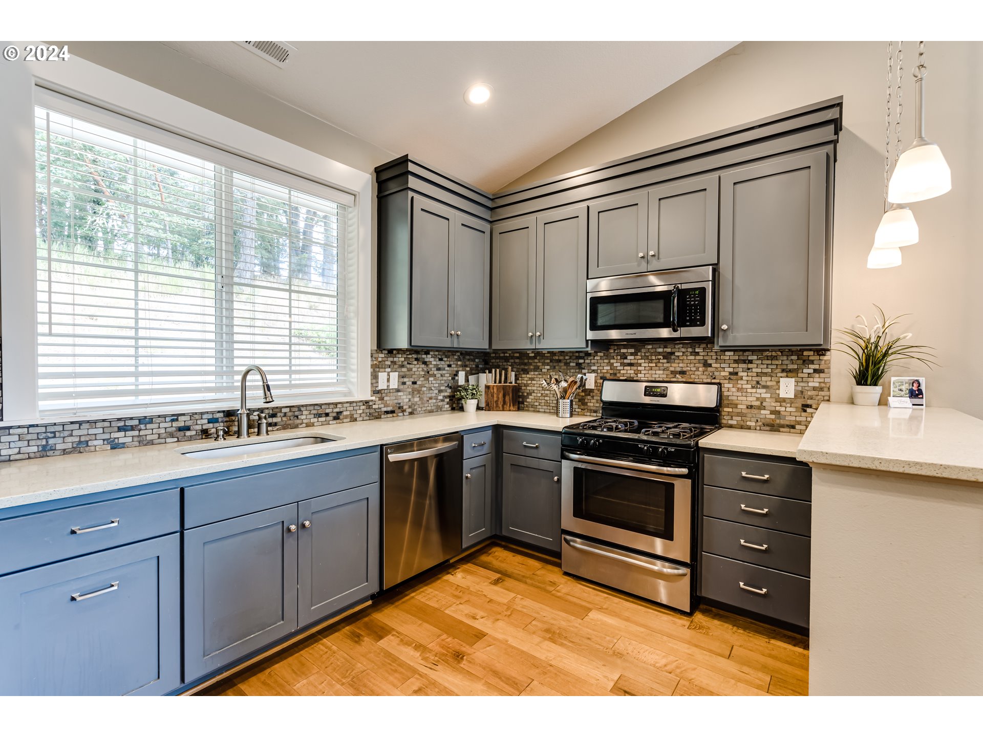 3278 Timberline Drive Eugene, OR 97405 - Photo 5 of 41 a kitchen with stainless steel appliances granite countertop a sink stove and microwave