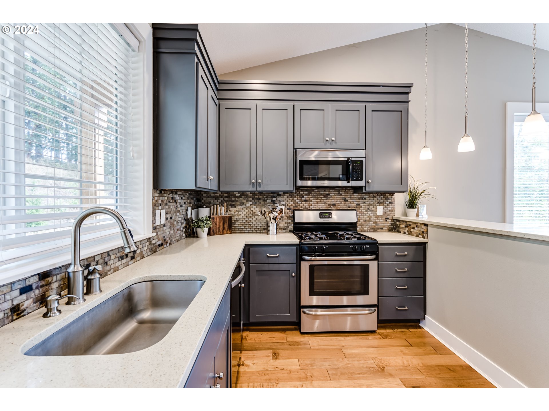3278 Timberline Drive Eugene, OR 97405 - Photo 6 of 41 a kitchen with a sink cabinets and stainless steel appliances