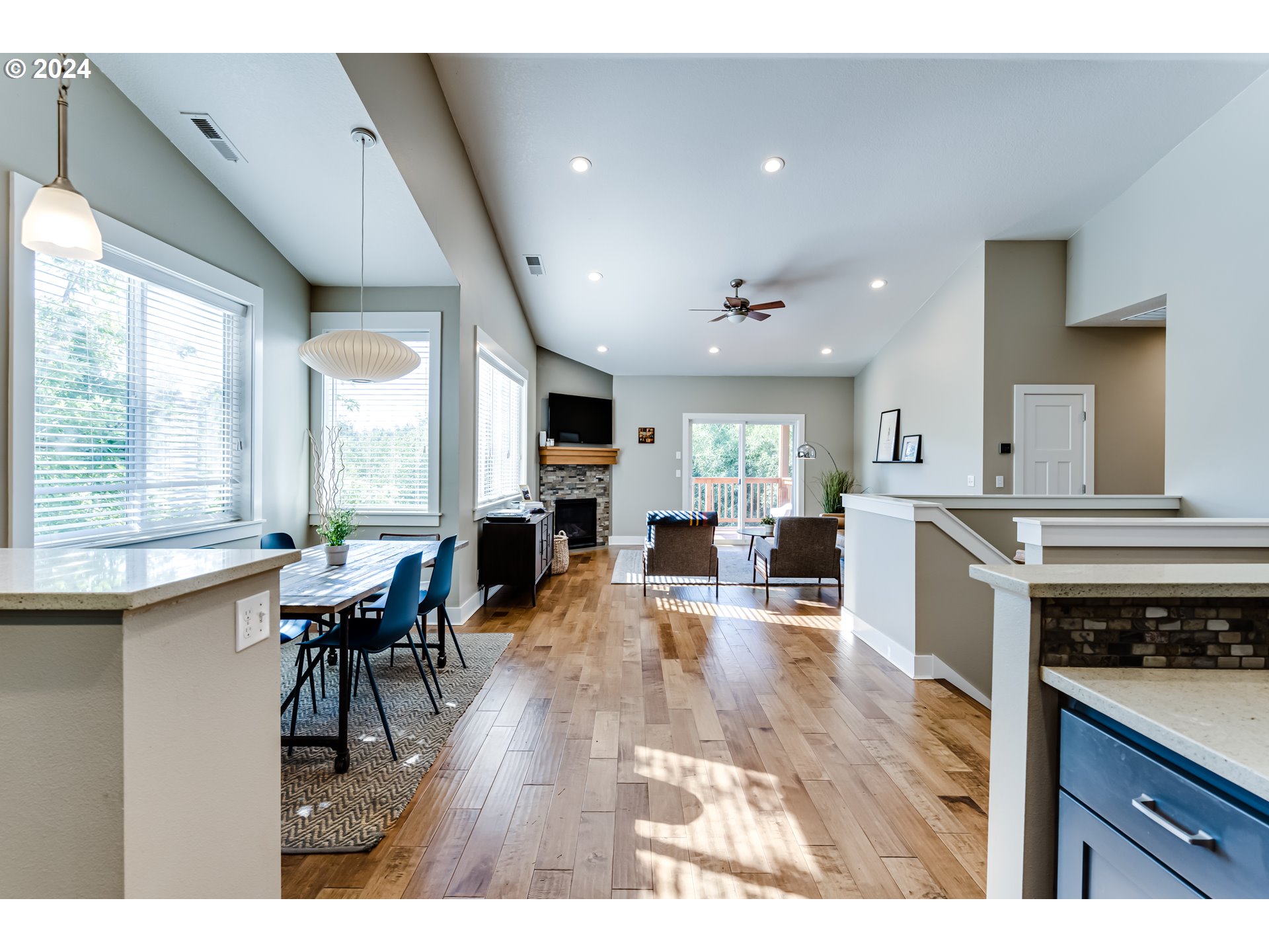 3278 Timberline Drive Eugene, OR 97405 - Photo 8 of 41 a living room with stainless steel appliances kitchen island granite countertop furniture and a wooden floor