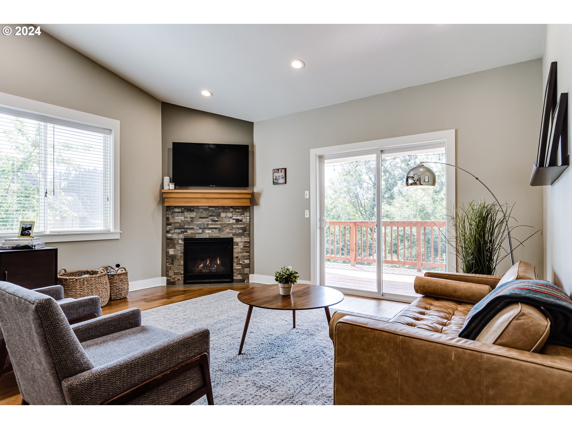 3278 Timberline Drive Eugene, OR 97405 - Photo 10 of 41 a living room with furniture a large window and a fireplace