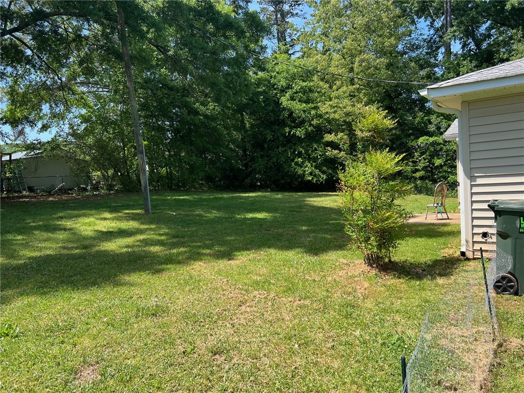 520 Ravenel Circle Seneca, SC 29678 - Photo 6 of 6 A verdant backyard offers a tranquil space for outdoor enjoyment.