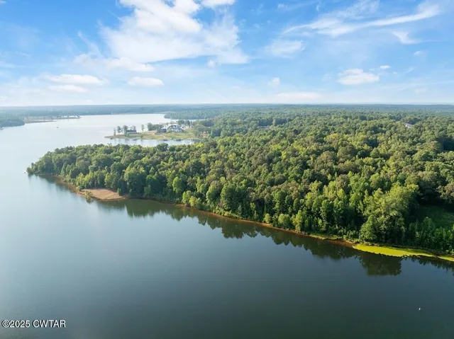 a view of a lake with a yard
