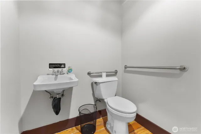 a white toilet sitting next to a bathroom sink