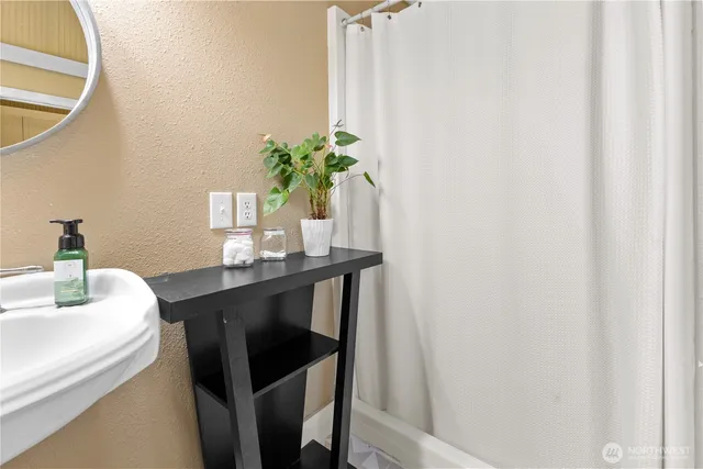 a dining room with furniture and potted plant