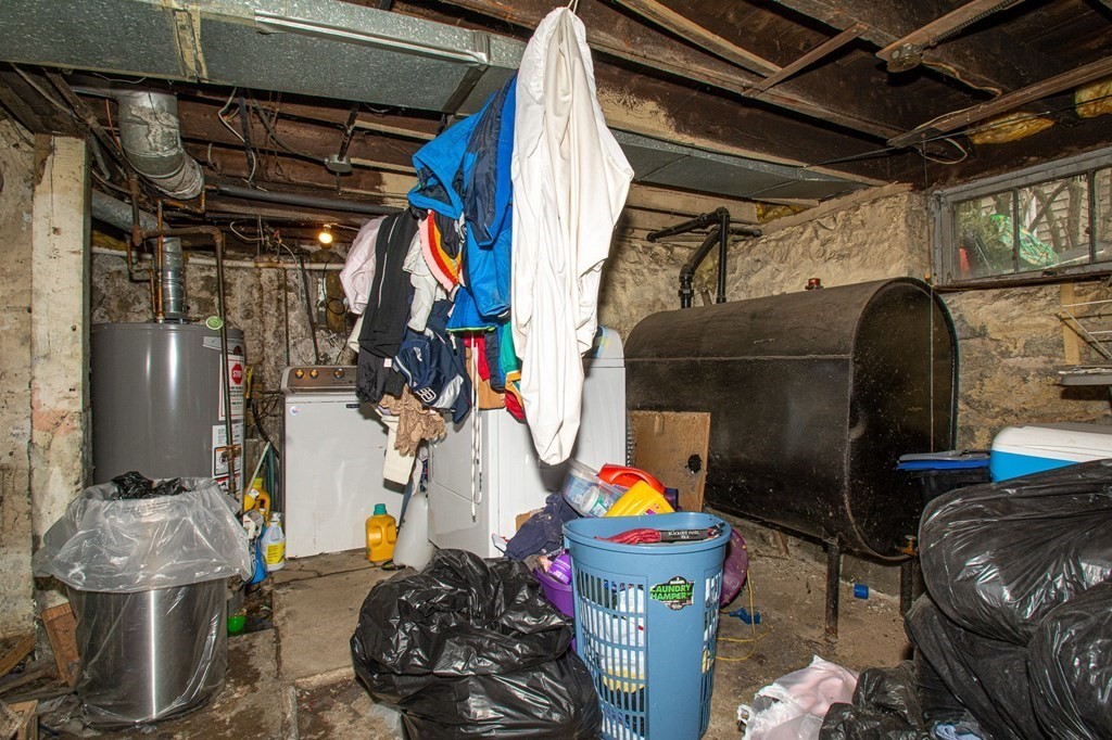 823 Broadway Everett, MA 02149 - Photo 14 of 16 a room with lots of different colored cloths