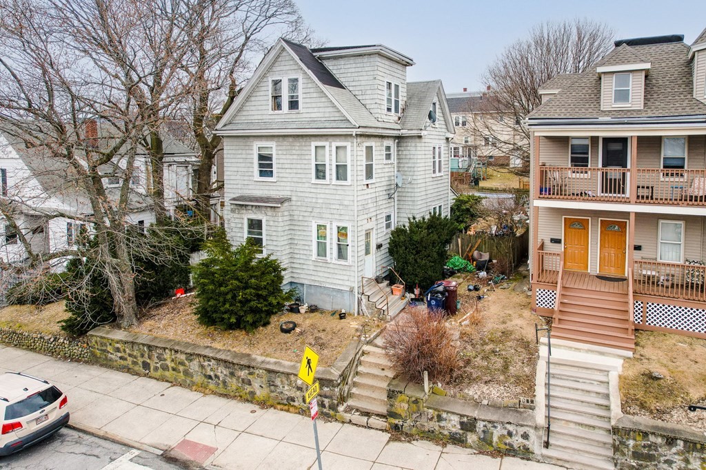 823 Broadway Everett, MA 02149 - Photo 2 of 16 a front view of a house with a yard