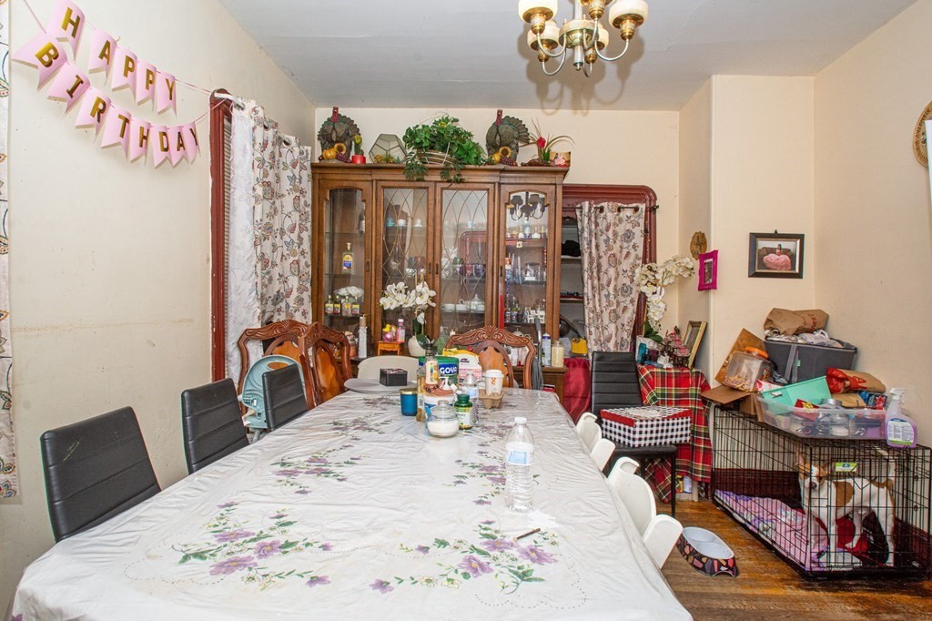 823 Broadway Everett, MA 02149 - Photo 4 of 16 a bedroom with furniture and window
