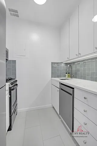 a view of wooden floor and windows in a room