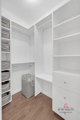 a kitchen with a sink and stainless steel appliances