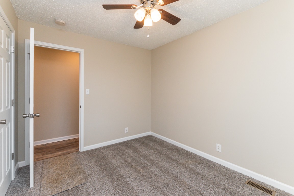 816 Garrettsburg Road Clarksville, TN 37042 - Photo 17 of 34 wooden floor in an empty room
