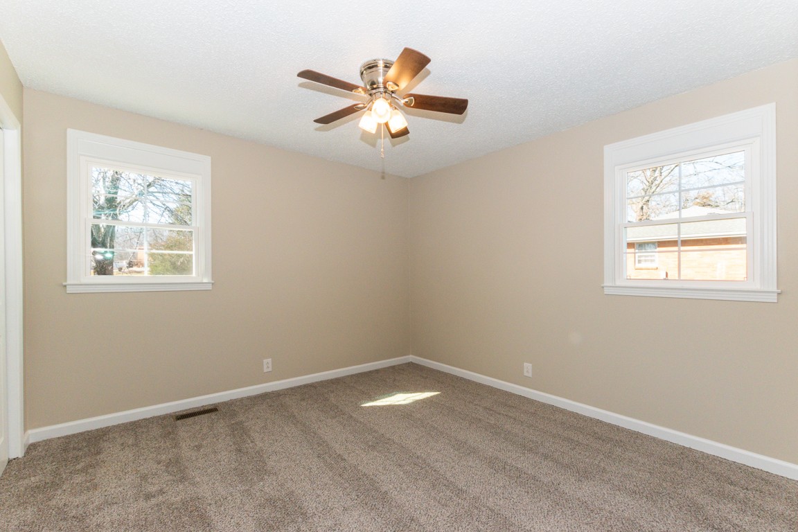 816 Garrettsburg Road Clarksville, TN 37042 - Photo 18 of 34 a view of empty room with wooden floor and fan