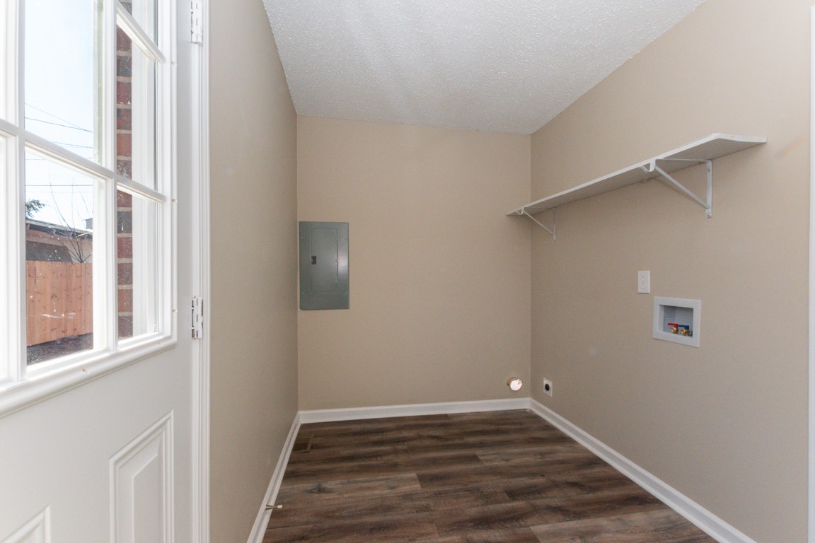 816 Garrettsburg Road Clarksville, TN 37042 - Photo 29 of 34 a view of an empty room with wooden floor and a window
