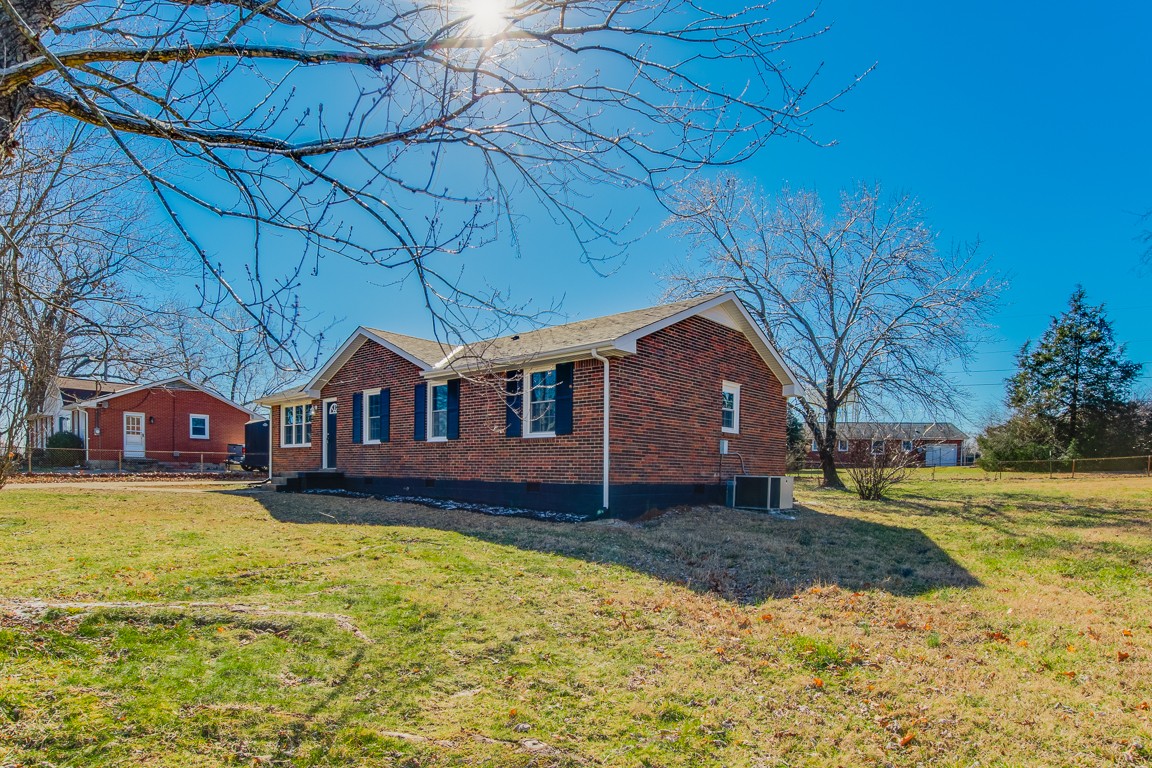 816 Garrettsburg Road Clarksville, TN 37042 - Photo 5 of 34 a front view of a house with a yard and garage