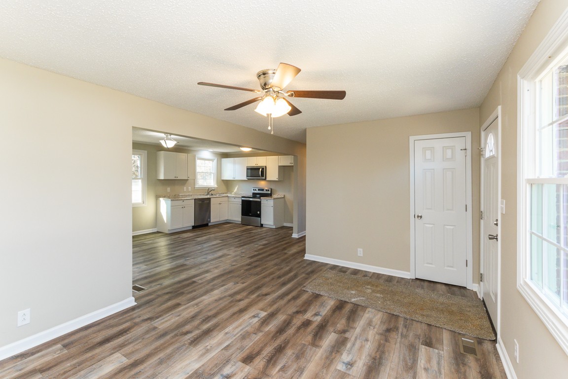 816 Garrettsburg Road Clarksville, TN 37042 - Photo 6 of 34 a view of empty room with wooden floor and fan
