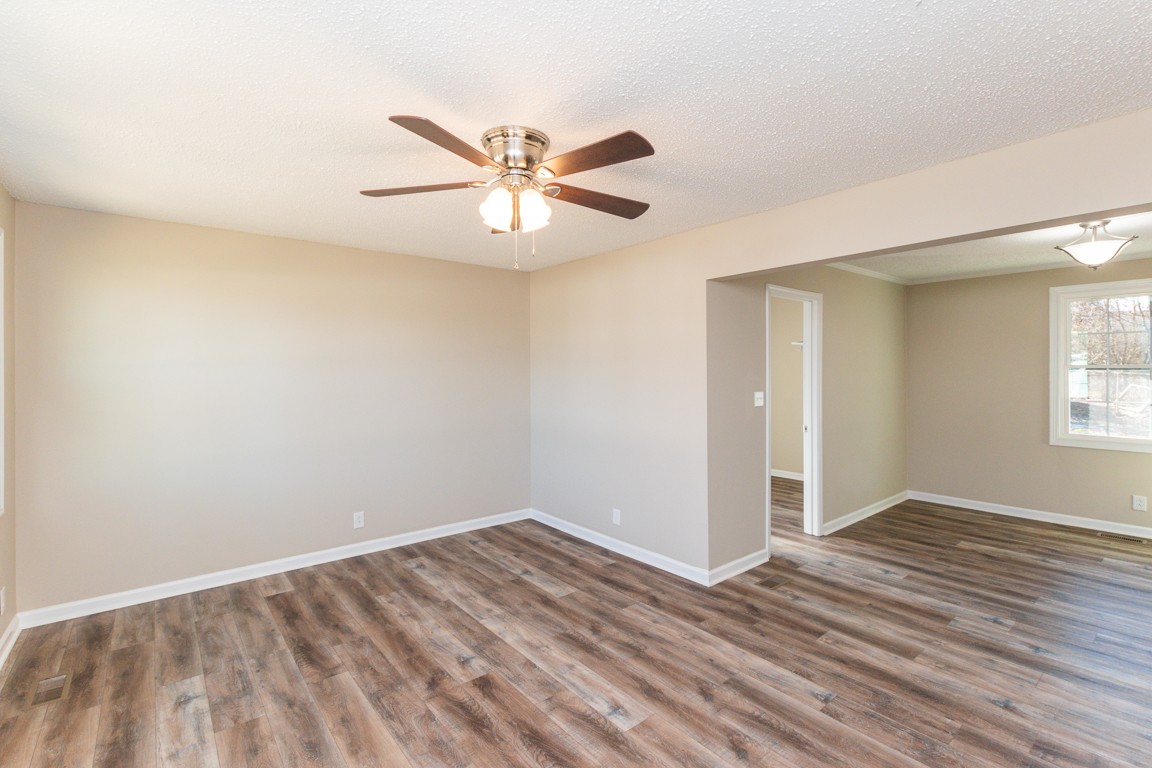 816 Garrettsburg Road Clarksville, TN 37042 - Photo 8 of 34 a view of empty room with wooden floor and fan